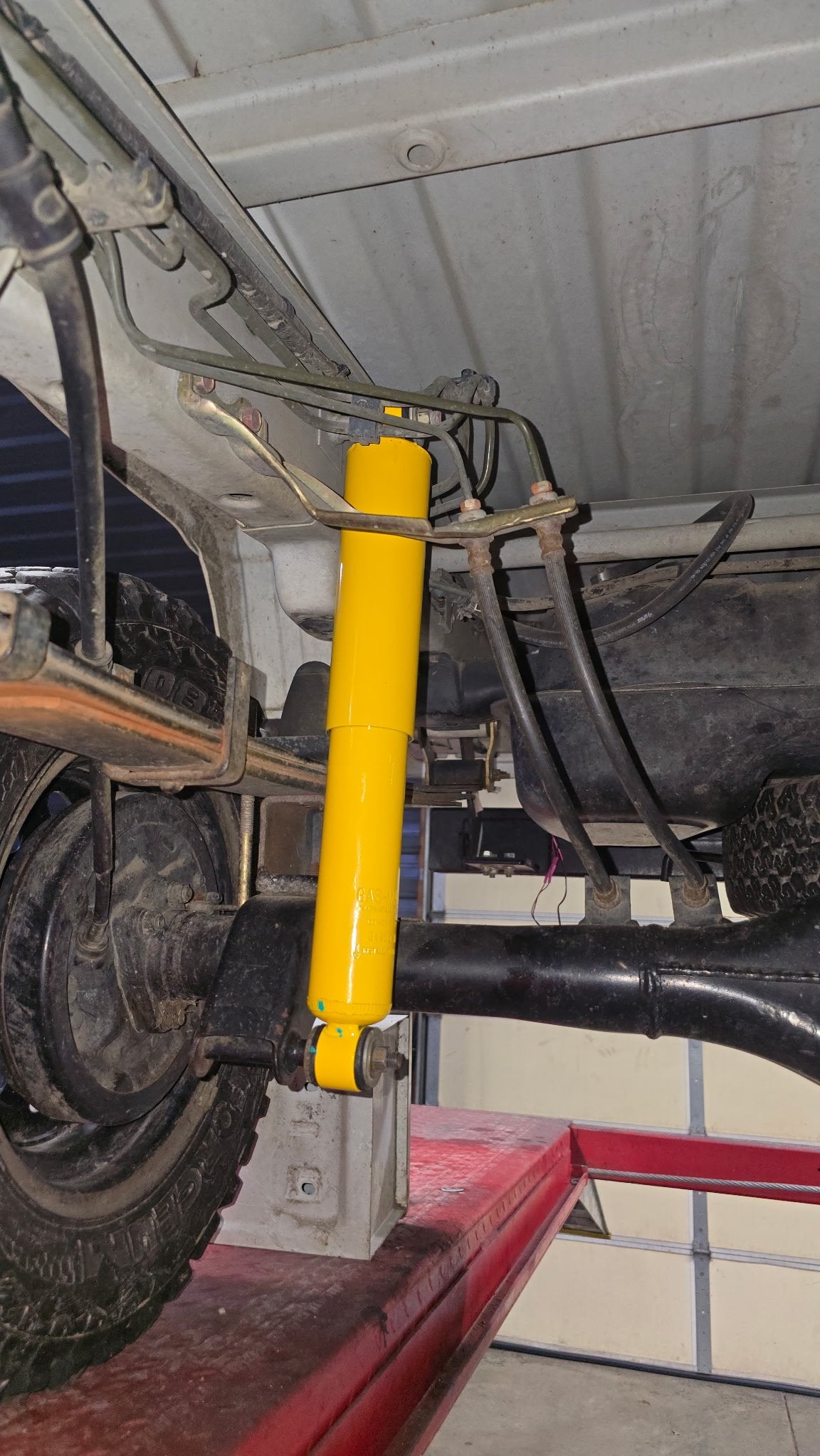 Extended rear shock installed — close-up, other side